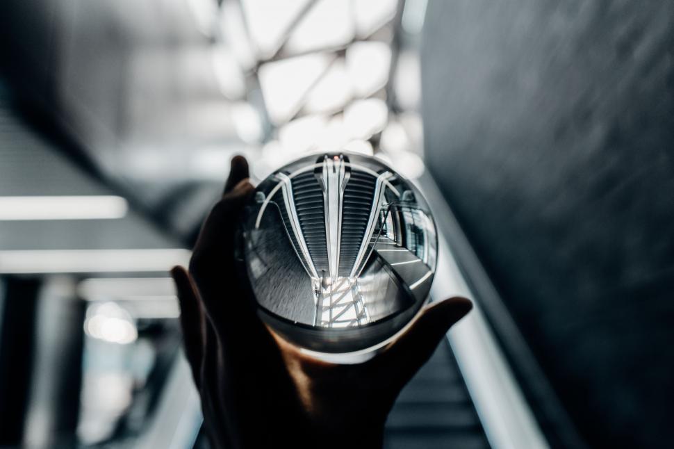 Free Image of Person Holding Glass Object 