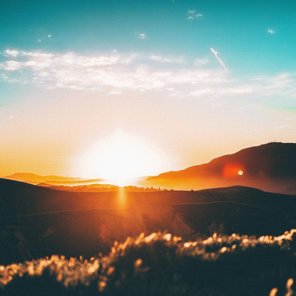 Free Image of Sun Setting Over Mountain Range 