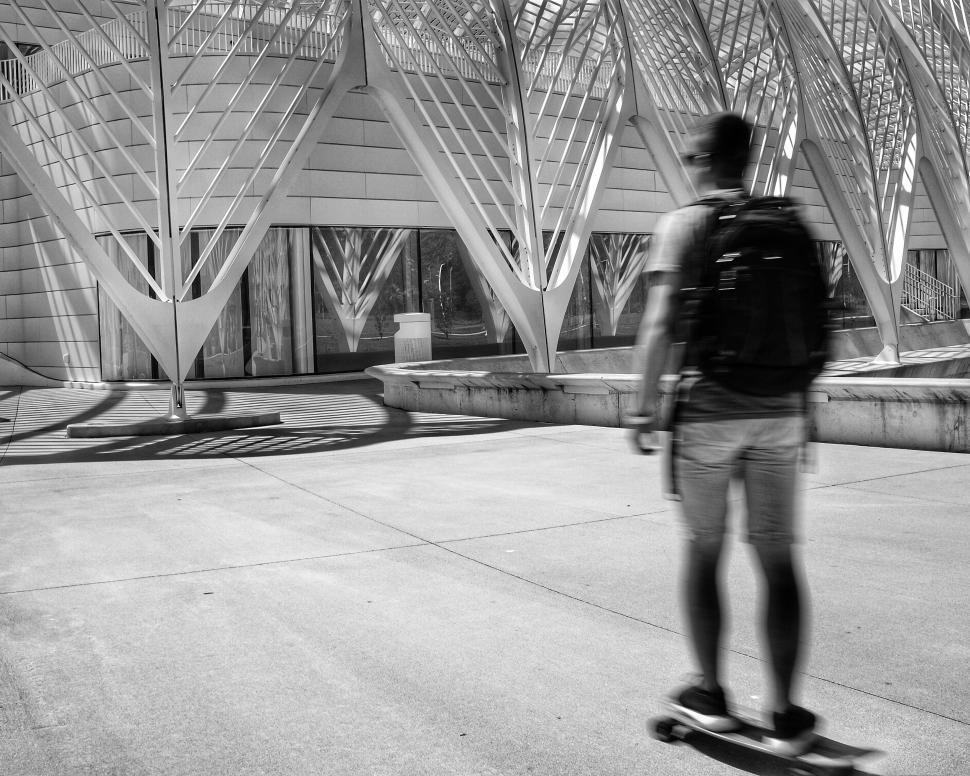 Free Image of Man Riding Skateboard Down Urban Street 