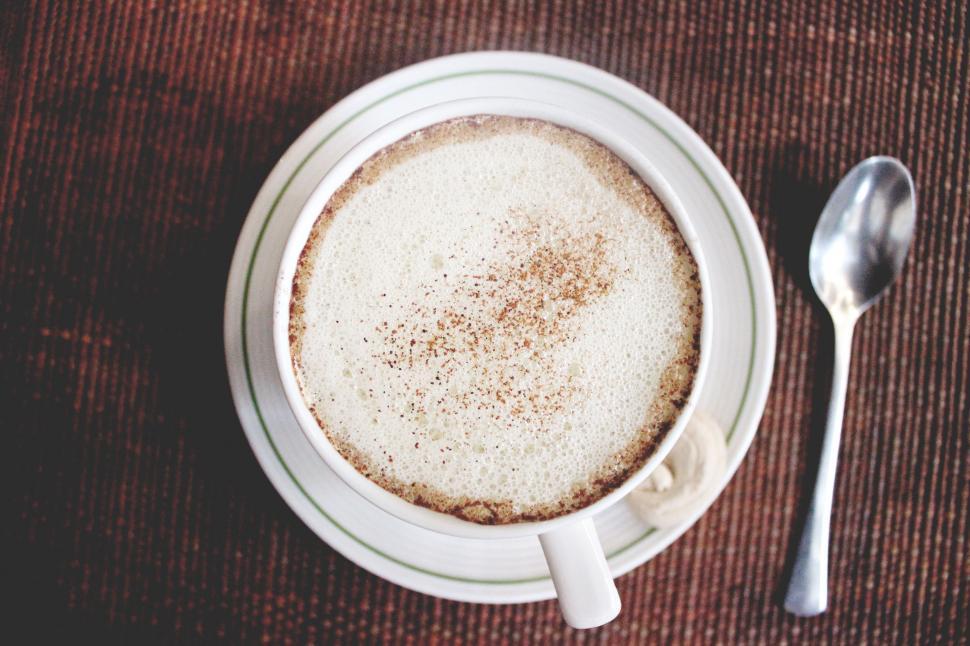 Free Image of A Cup of Coffee and a Spoon on a Table 
