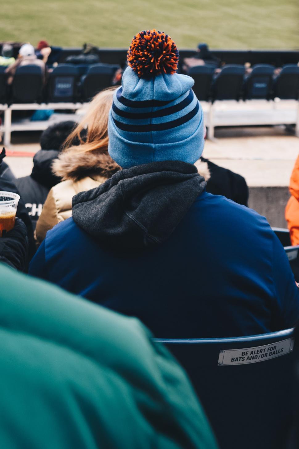 Free Image of Group of People Sitting in the Stands at a Baseball Game 