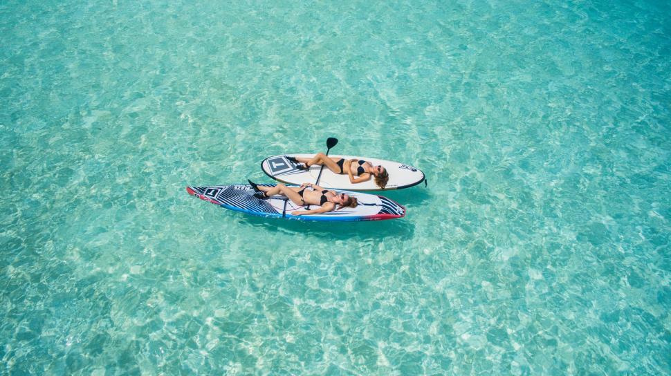 Free Image of People Riding on Top of a Paddle Boat 