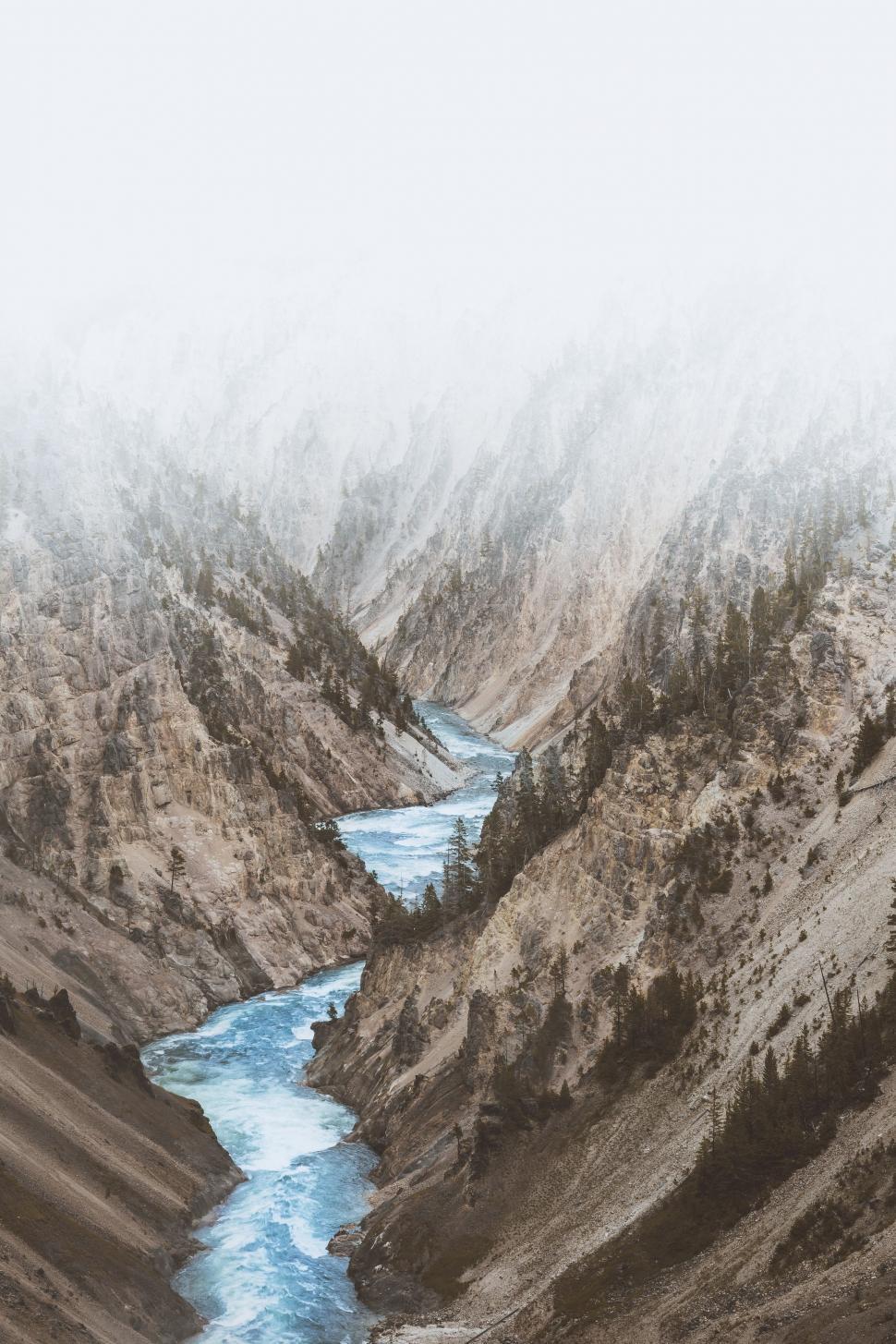 Free Image of River Flowing Through Valley Surrounded by Mountains 