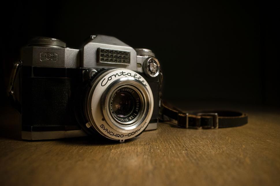 Free Image of Camera on Wooden Table 