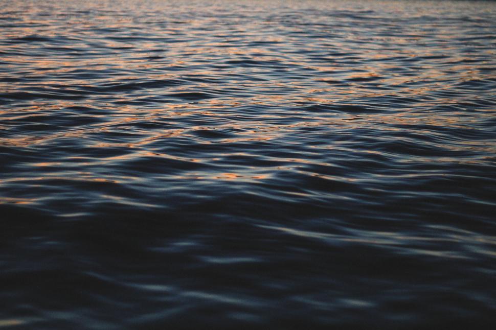Free Image of Boat Sailing on Vast Body of Water 
