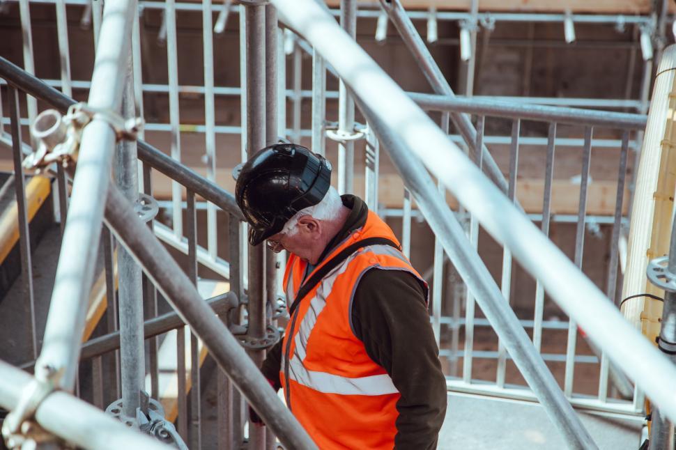 Free Image of Man in Orange Vest and Safety Vest 