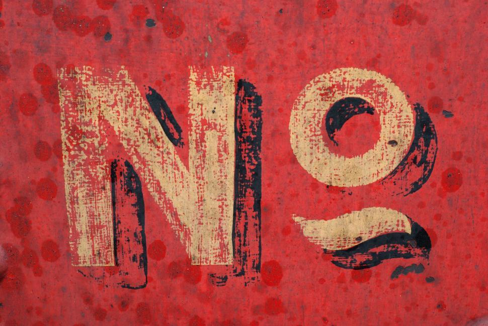 Free Image of Close Up of Red Sign With White Letters 