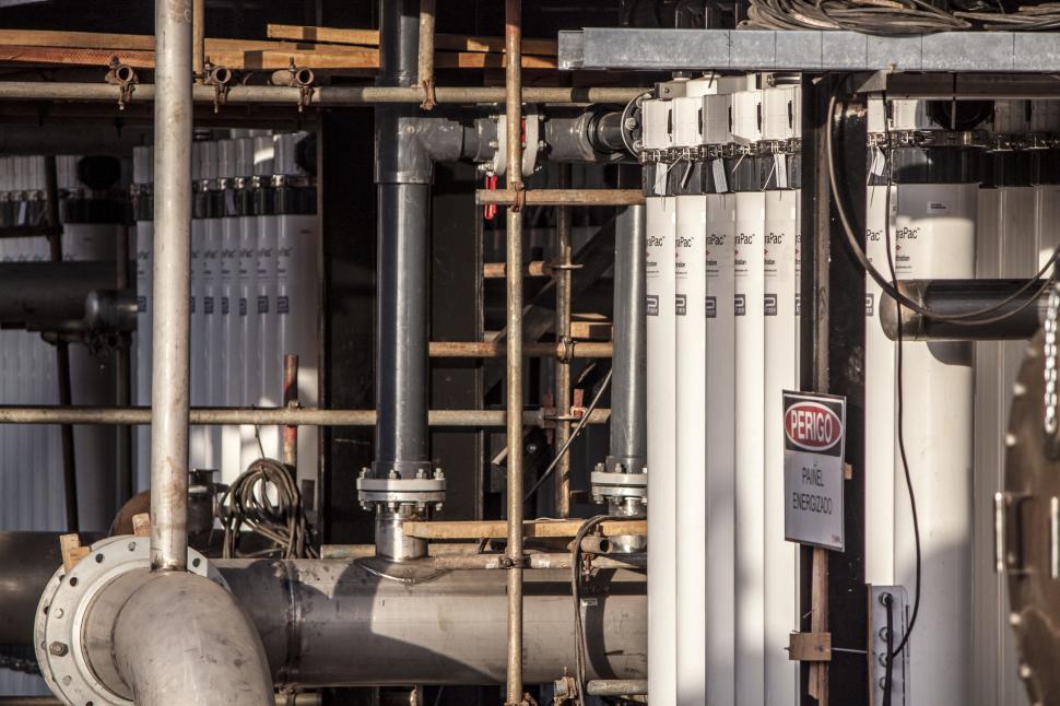 Free Image of Pipes and Valves in a Large Industrial Building 