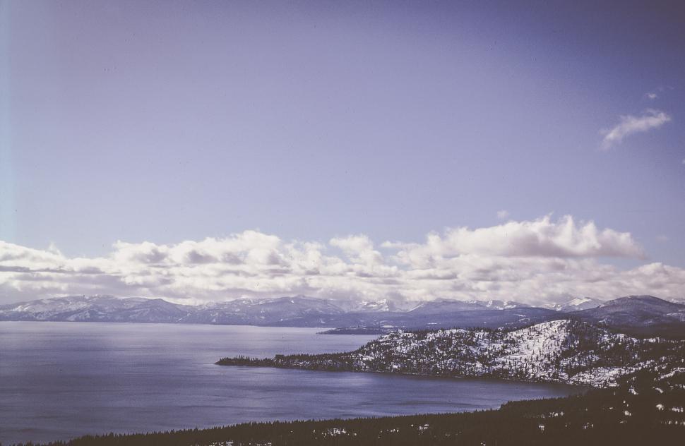 Free Image of Snow covered mountain engulfed in clouds 