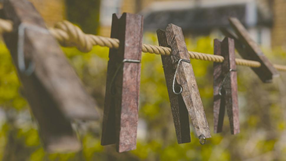 Clothes Pins On A Clothes Line Rope Four Wooden Pegs Holding