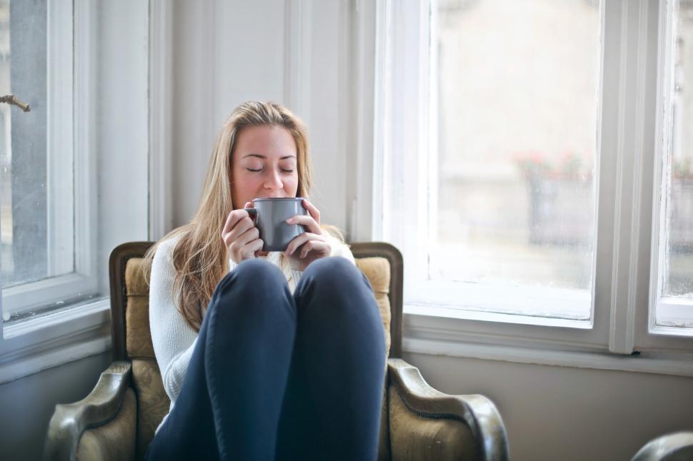 Free Image of Woman Holding Gray Ceramic Mug 