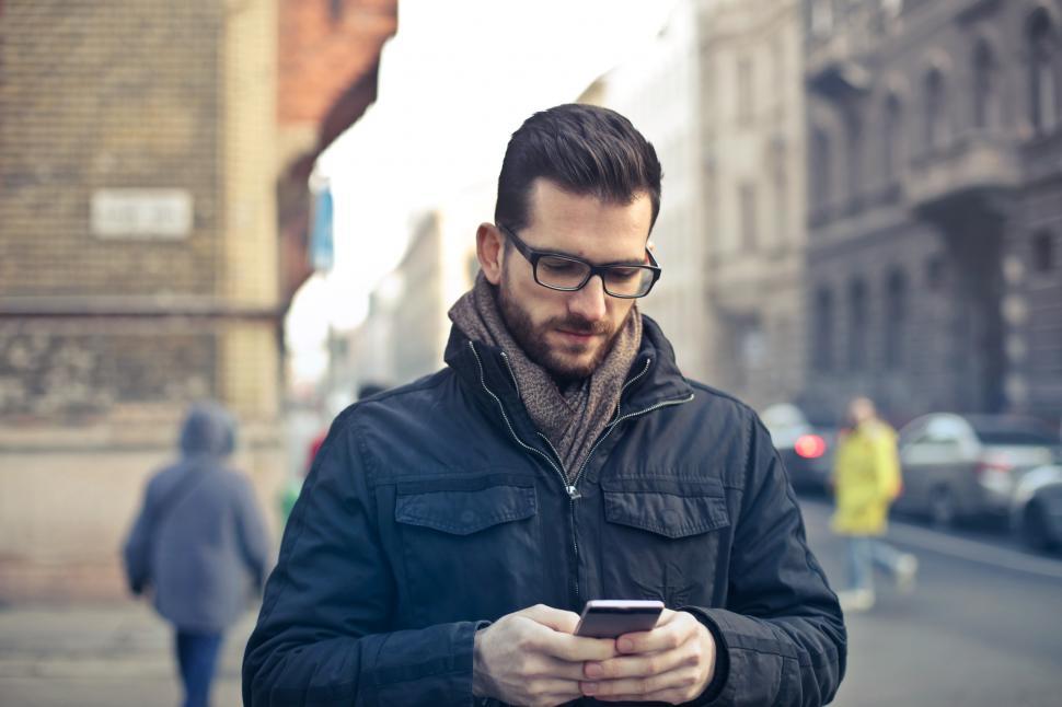 Mobile gadget dependence. Man bearded hipster play smartphone