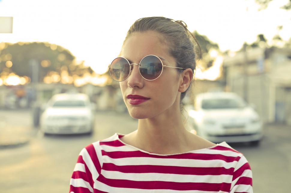 Young Woman In Sunglasses And Red And White Striped T-Shirt