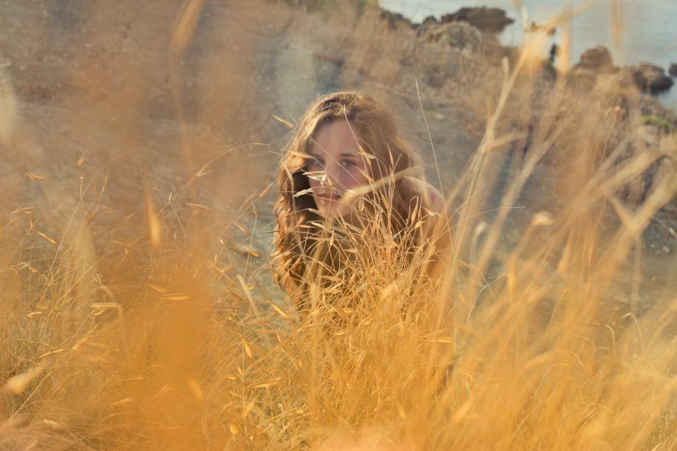 Free Image of A young woman posing in the meadow 