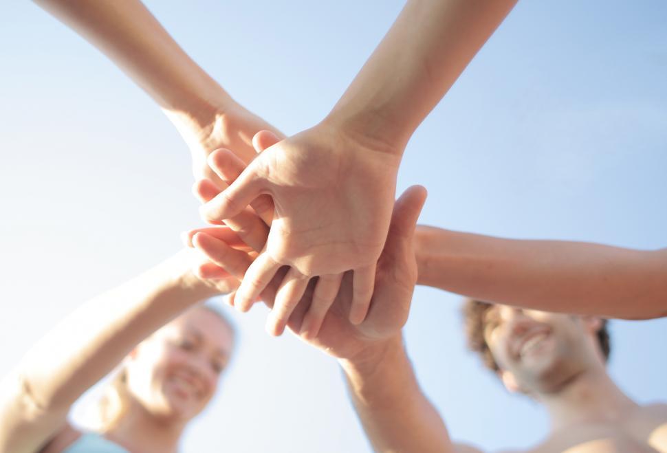 Free Image of A group of people in a huddle outdoors 