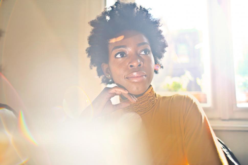 Free Image of A young African woman posing indoors 