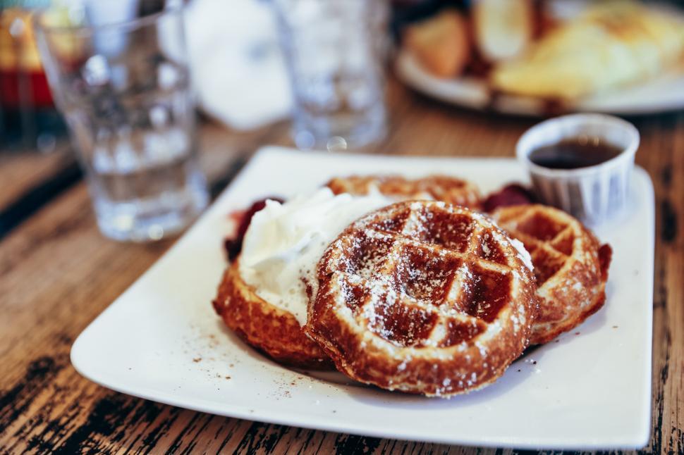 Free Image of Close-up of waffles and whipped cream 