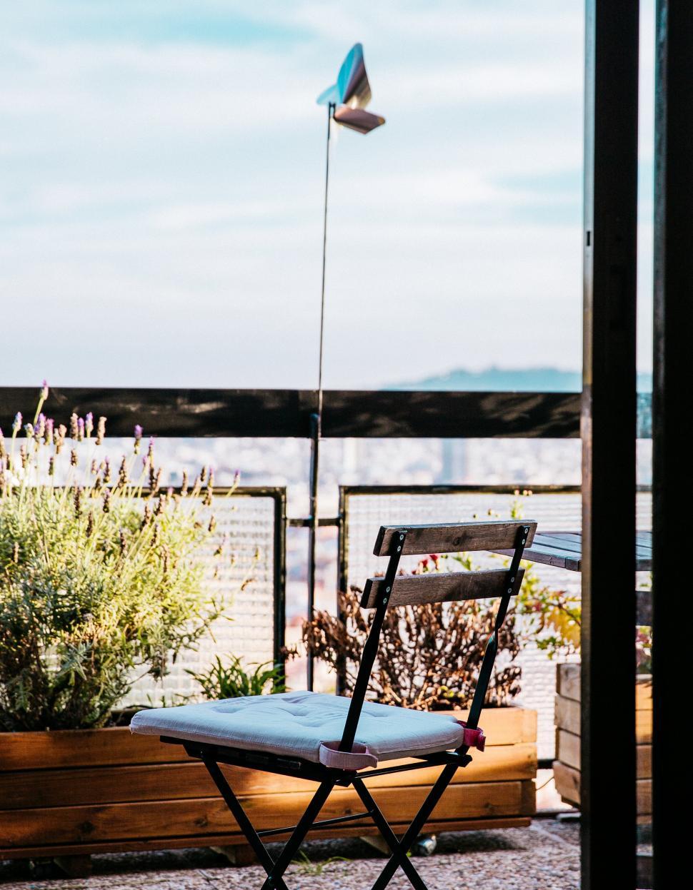 Free Image of A patio chair on balcony 
