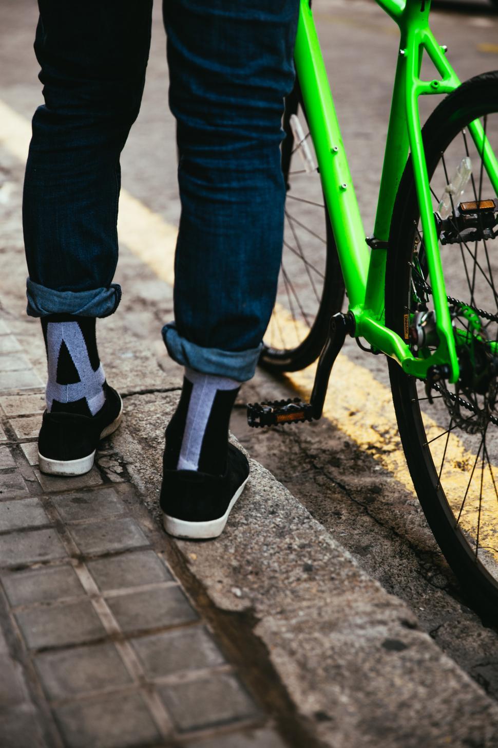 Free Image of A biker s feet with green bicycle 