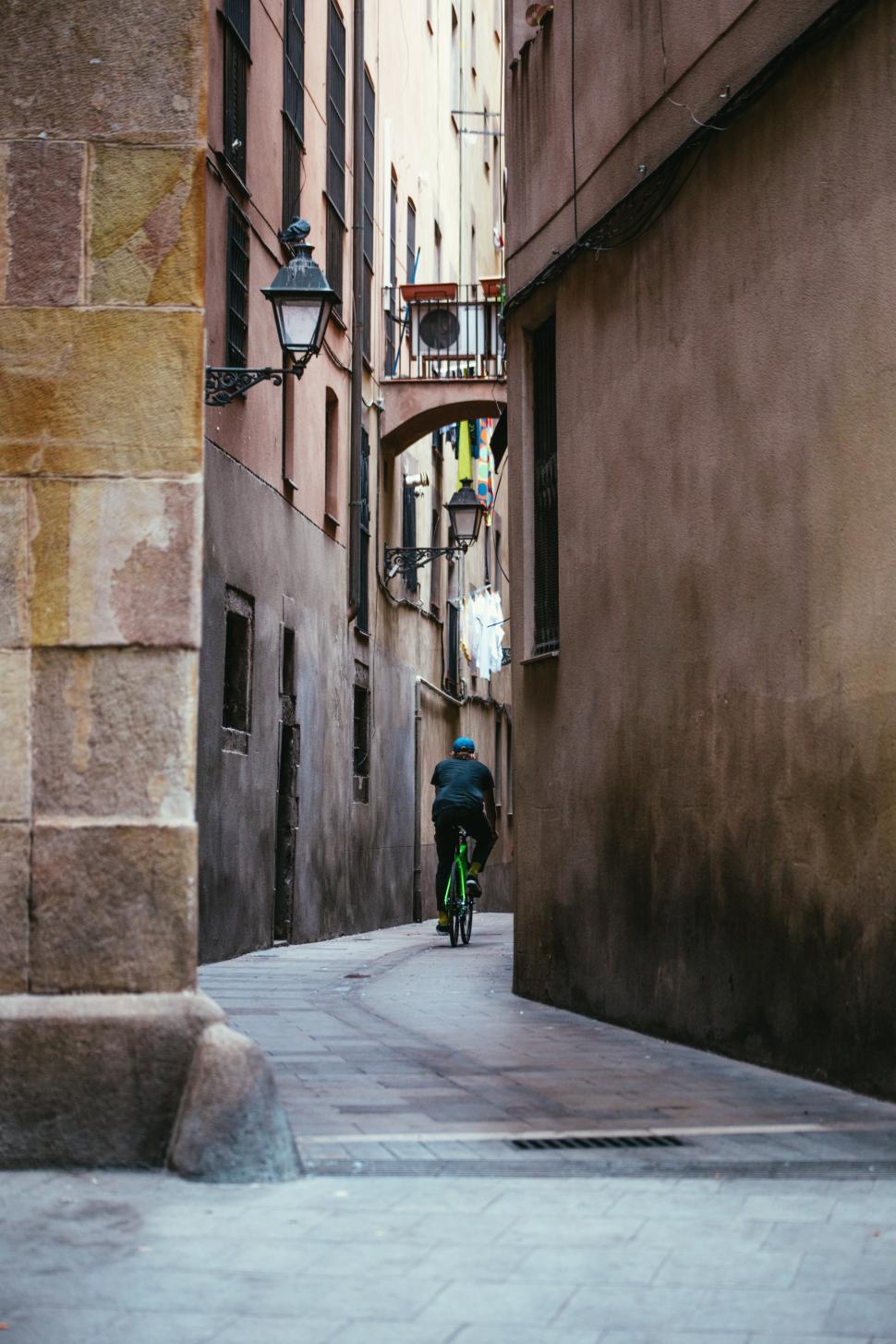 Free Stock Photo Of Cycling Down A Narrow Alley 