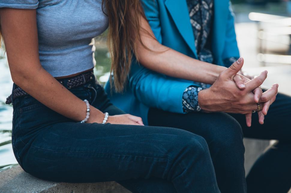 Free Image of A young caucasian couple sitting together 