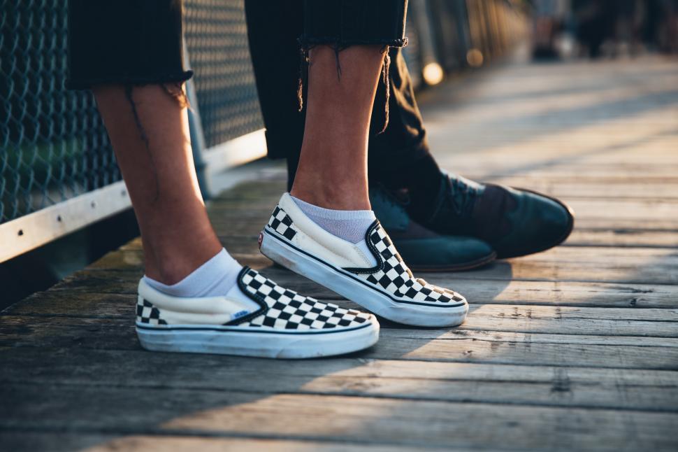 Free Stock Photo of A couple s feet with focus on woman s sneakers ...