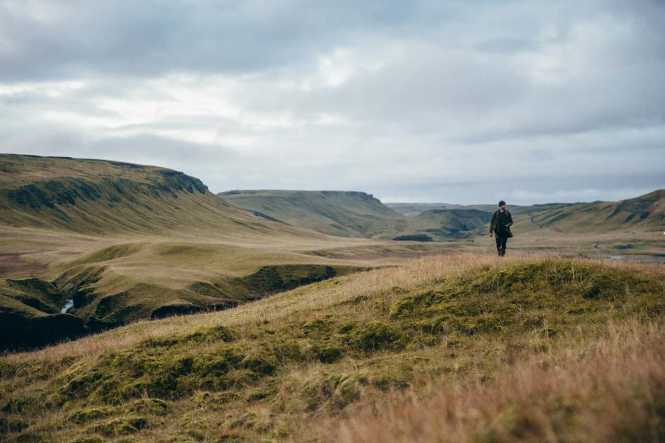 Free Image of A hiker in rocky Iceland field 