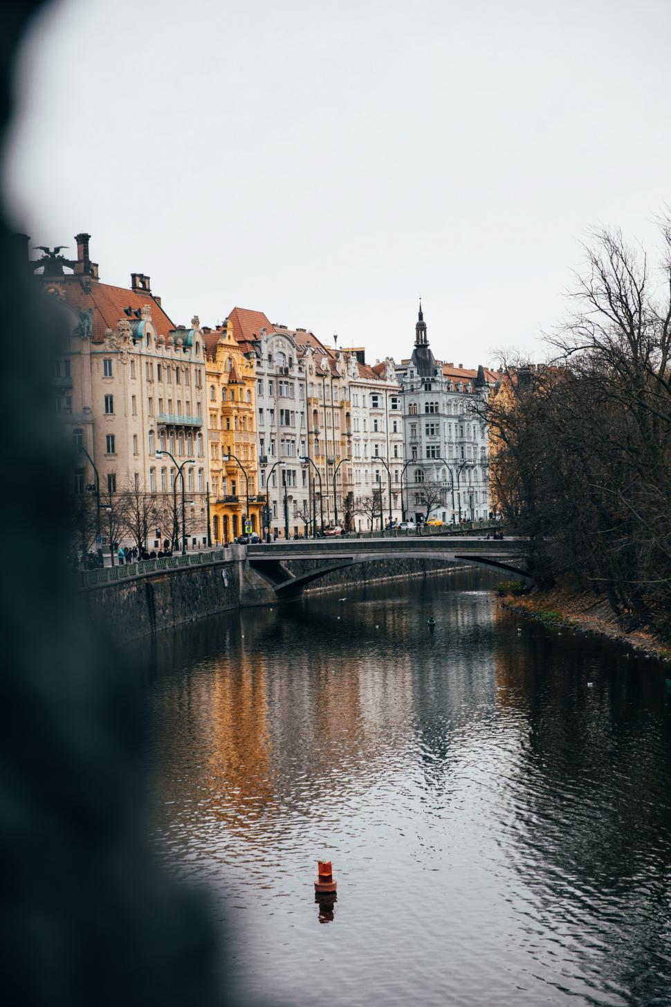 Free Image of A view of historic homes by the river 