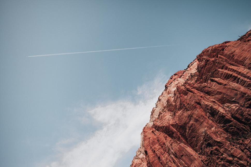 Free Image of Jetstream following an air plane over grand canyon 