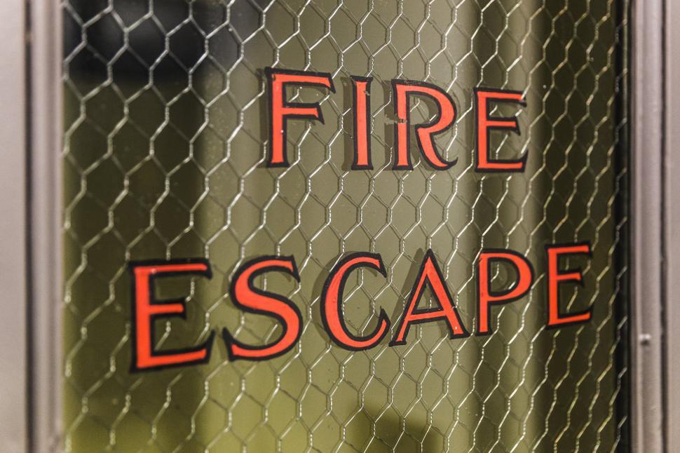 Free Image of Close up of Fire Escape written on a door 
