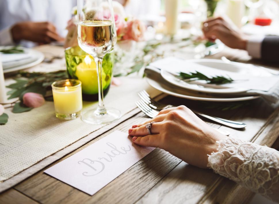 Free Image of Close up of a bride s hand on the table 