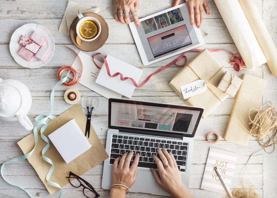 Free Image of Women s hands working on laptop and a tablet PC 
