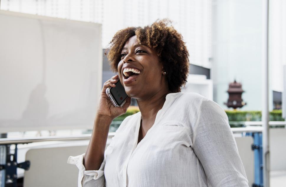 Free Image of A young woman talking on her mobile phone 