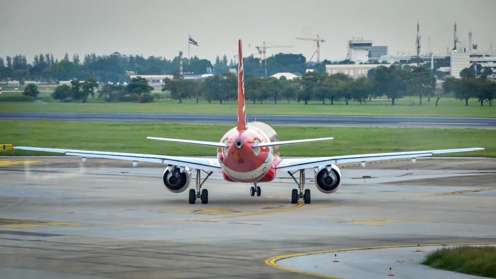 Free Stock Photo of Rear of Plane taxi on runway Download Free Images
