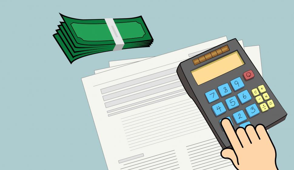 Free Image of Person Holding Calculator Over Pile of Papers 