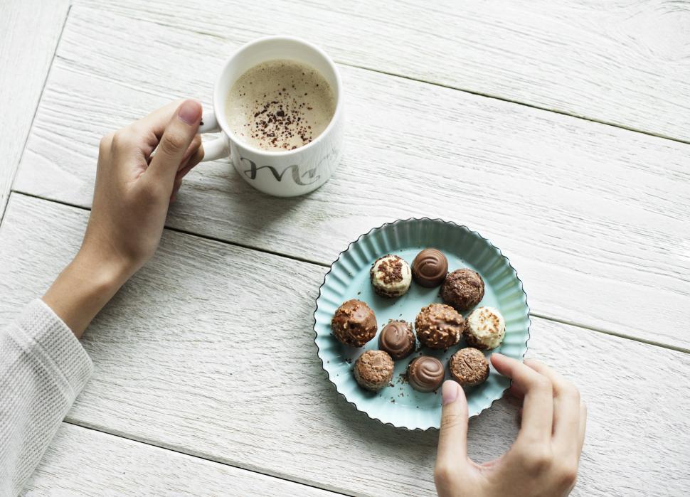 Free Image of Flat lay of chocolate candies and a coffee mug 