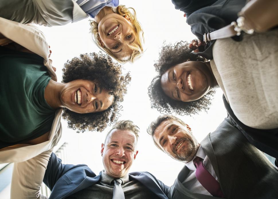 Free Image of Low angle view looking up at a team huddle 