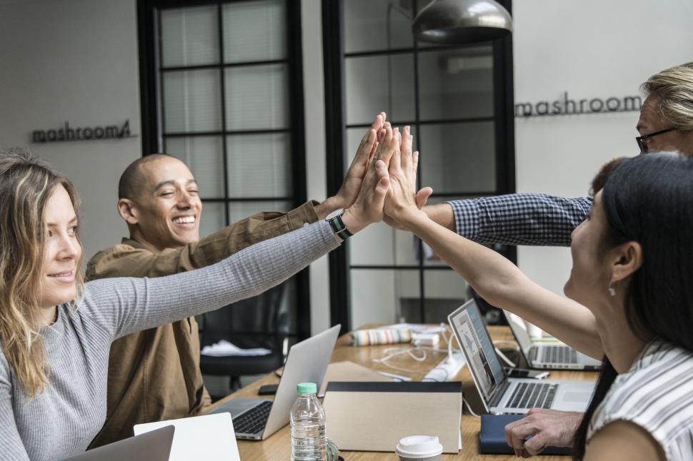 Free Stock Photo of Happy coworkers giving high five in the office |  Download Free Images and Free Illustrations