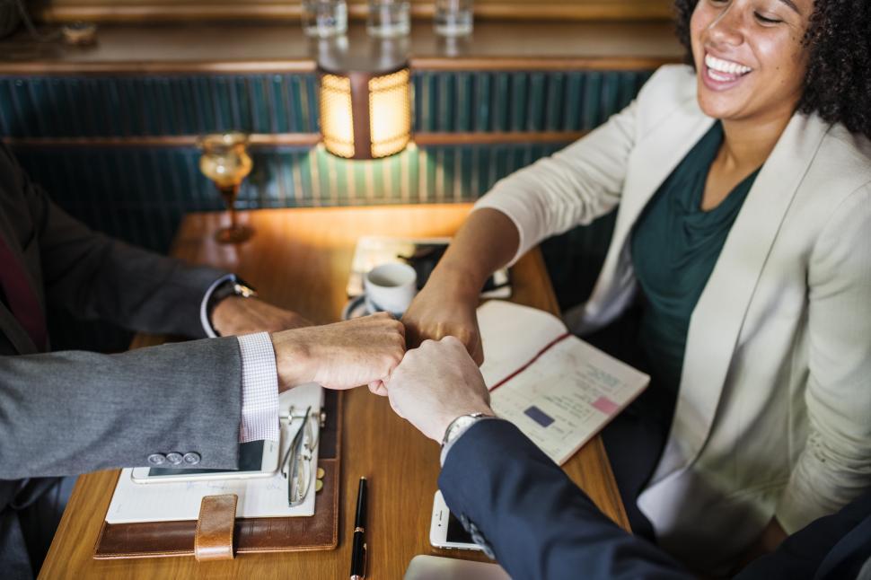 Free Image of A business team giving a triple Fist Bump 
