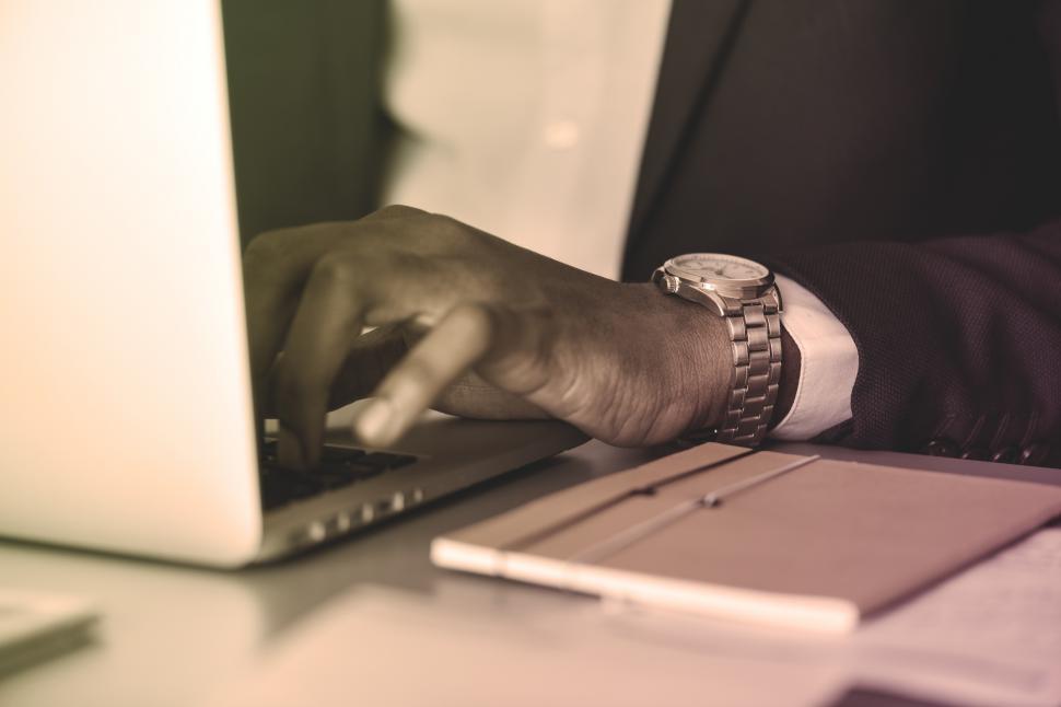 Free Image of Close up of a businessman working on laptop 