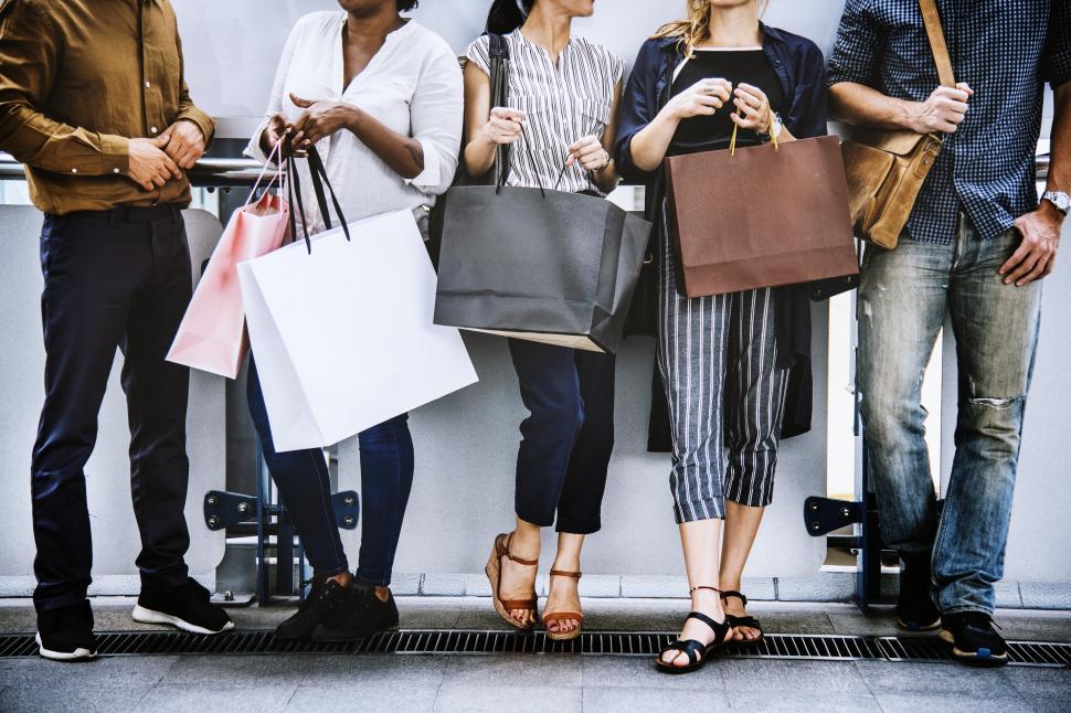 Free Stock Photo of Shopping bags and a group of multiethnic shoppers