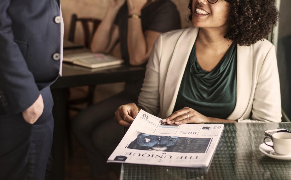 Free Image of Seated woman at a cafe 