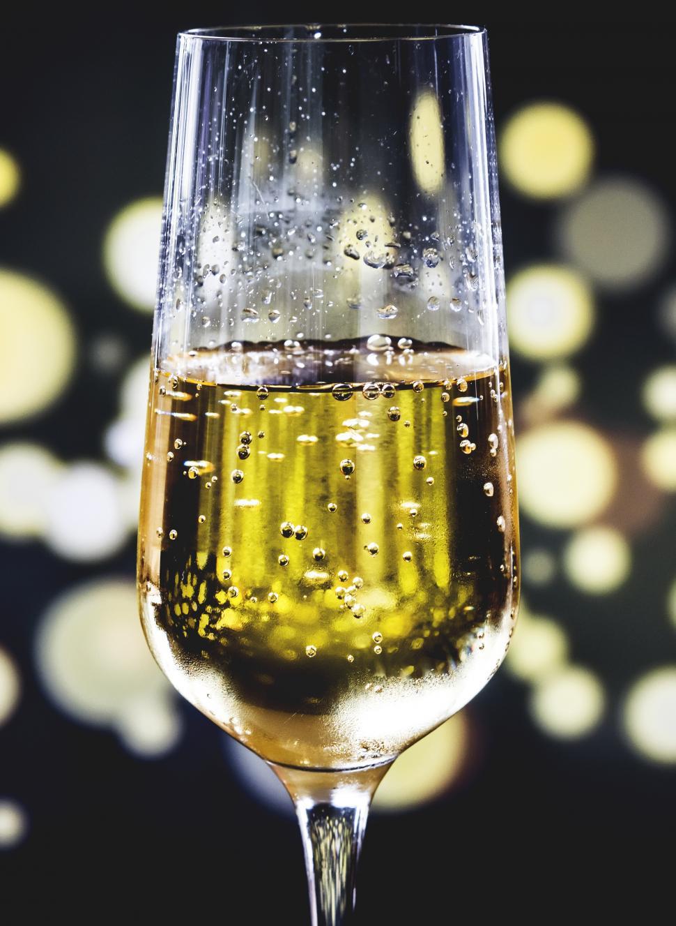 Free Image of Close up of a champagne glass and dark background 
