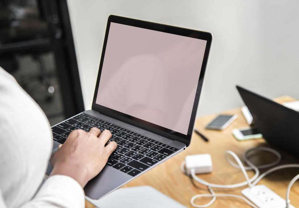 Free Image of Close up of a woman s hands typing on the laptop - blank screen 