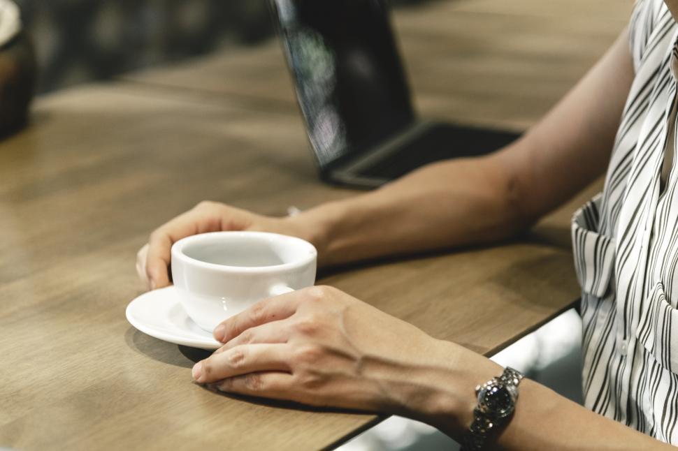 Free Image of Close up of a woman with a cup of coffee 