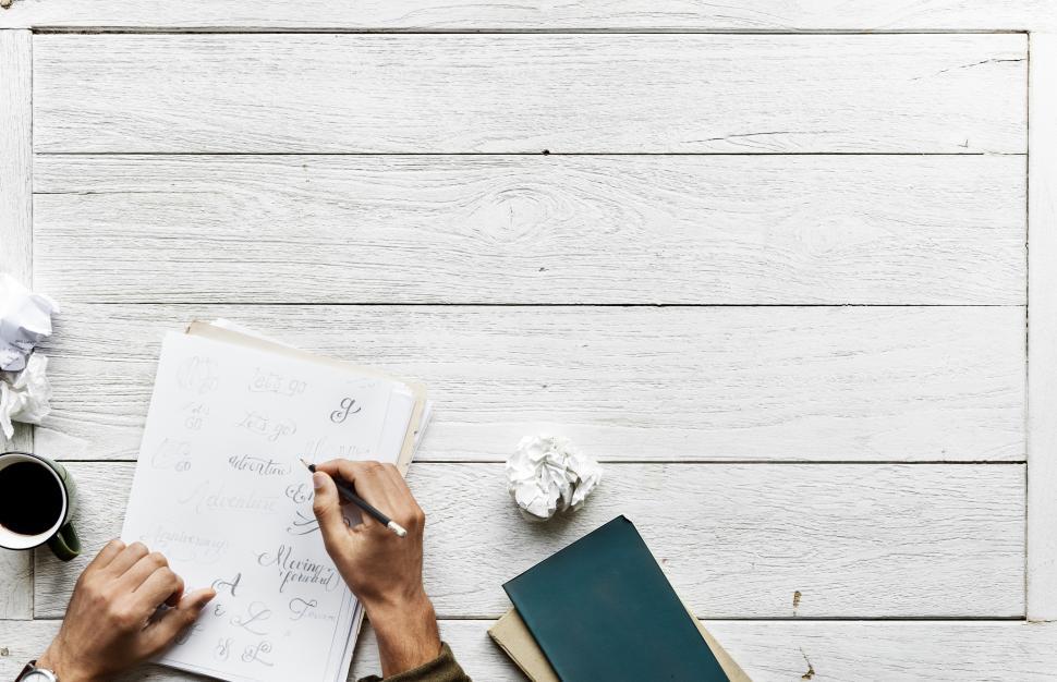 Free Stock Photo of Overhead view of a person writing calligraphy with