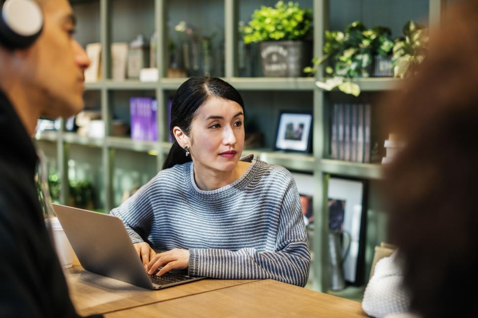 Free Image of A young woman typing on her laptop 