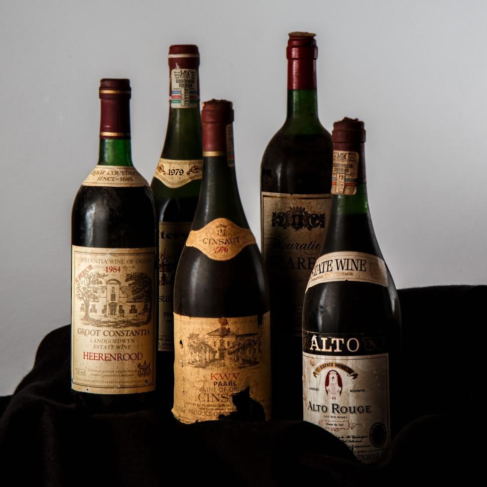 Free Image of Group of Wine Bottles Arranged Neatly 