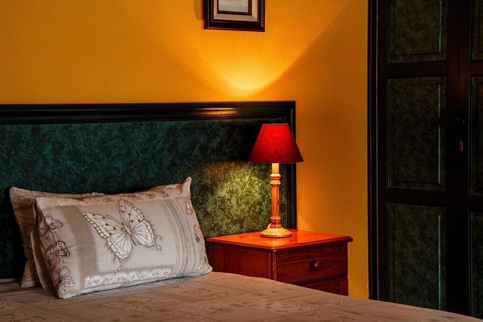 bedroom-with-pillows-and-yellow-wall.jpg