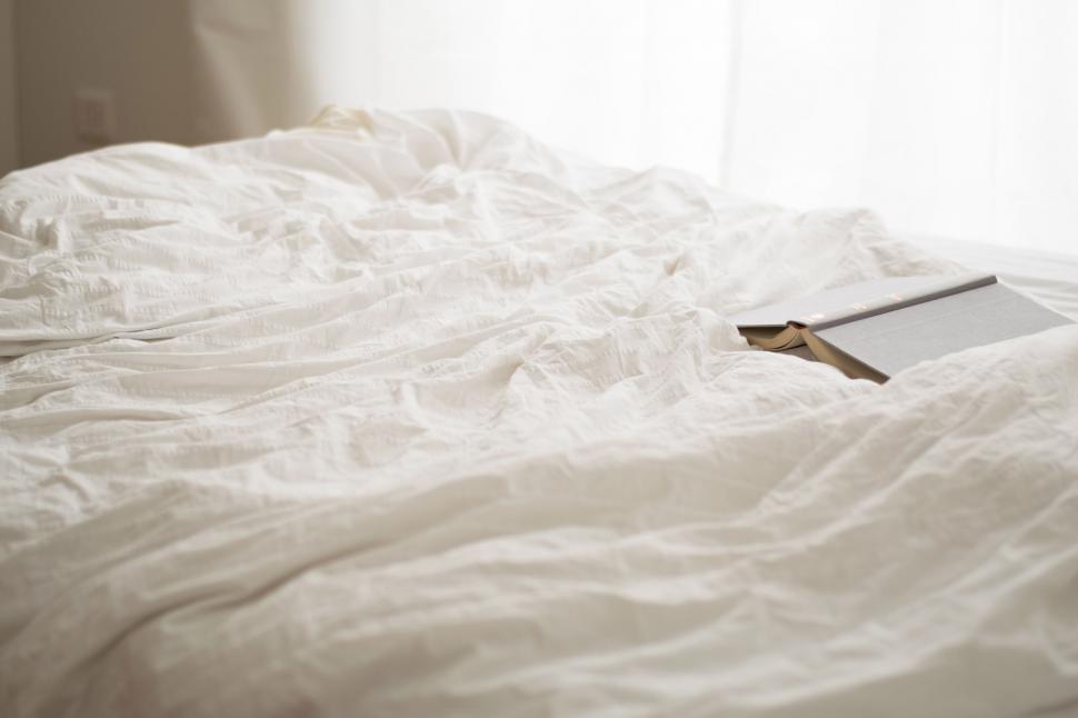 Free Image of Book on Bed 